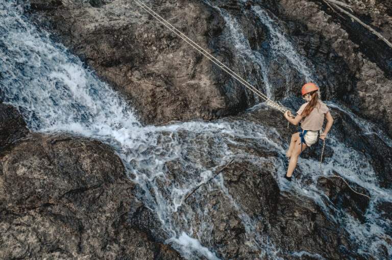 Young girl abseiling in Nightcap National Park