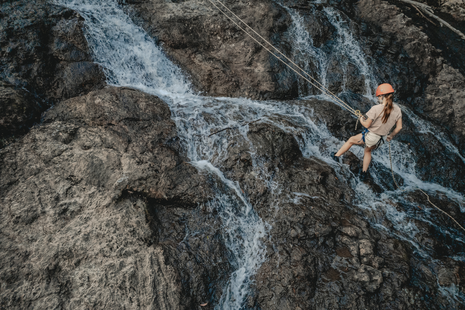 Young girl abseiling in Nightcap National Park