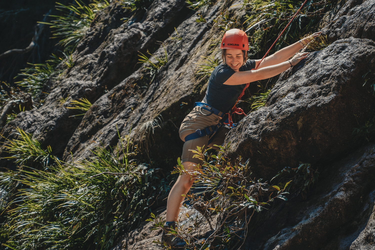 Visitor abseiling in Nightcap National Park