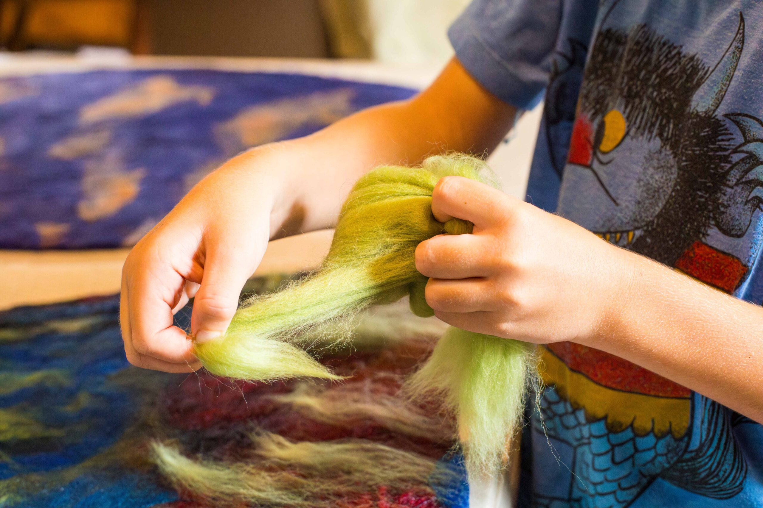 Pulling the fibres to make the felt hat