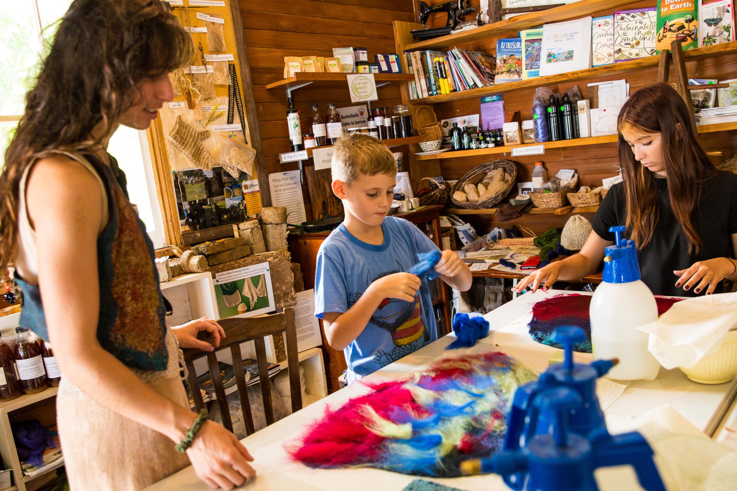 Young boy learning the art of felt making