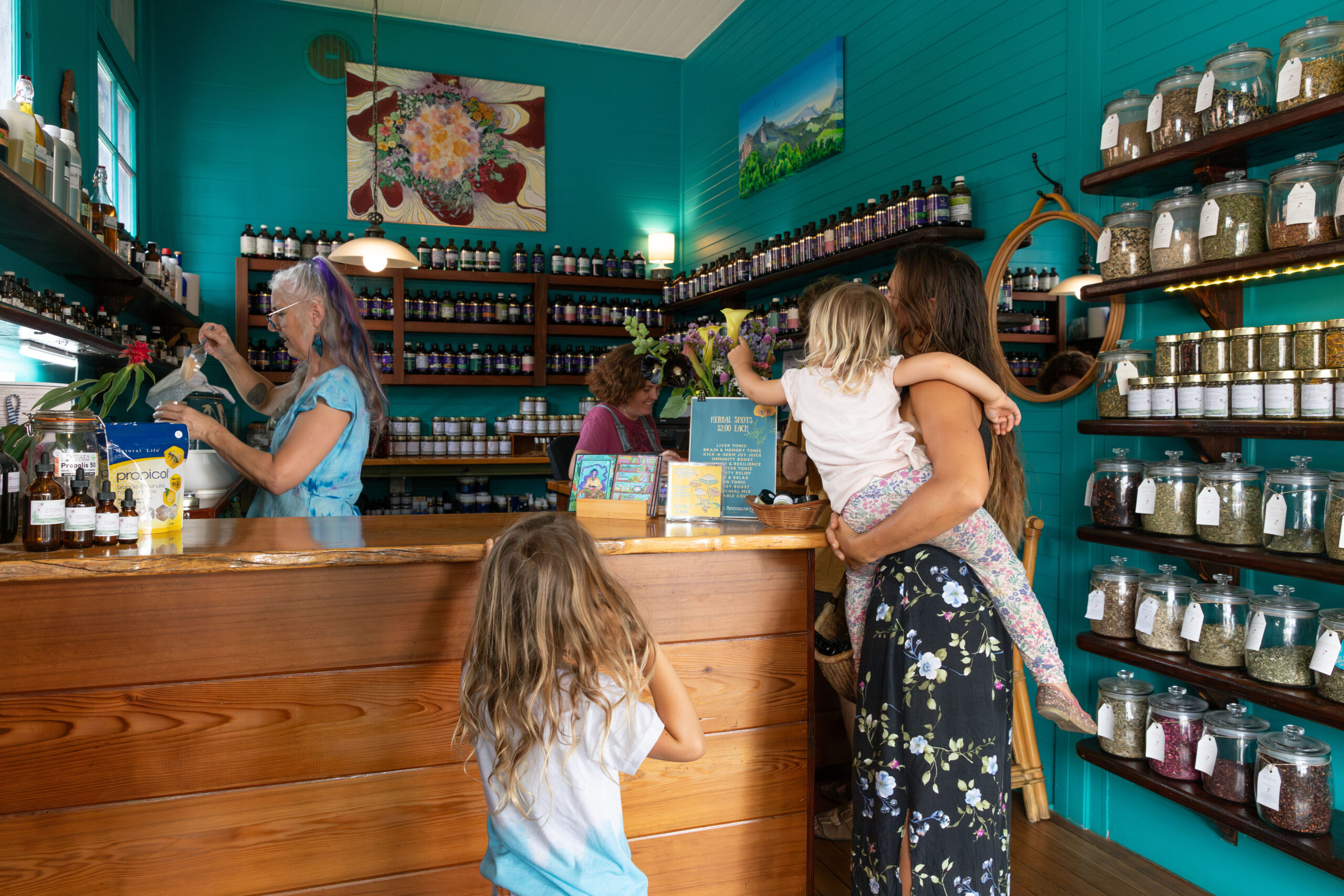 Family picking up organic teas from the Nimbin Apothecary