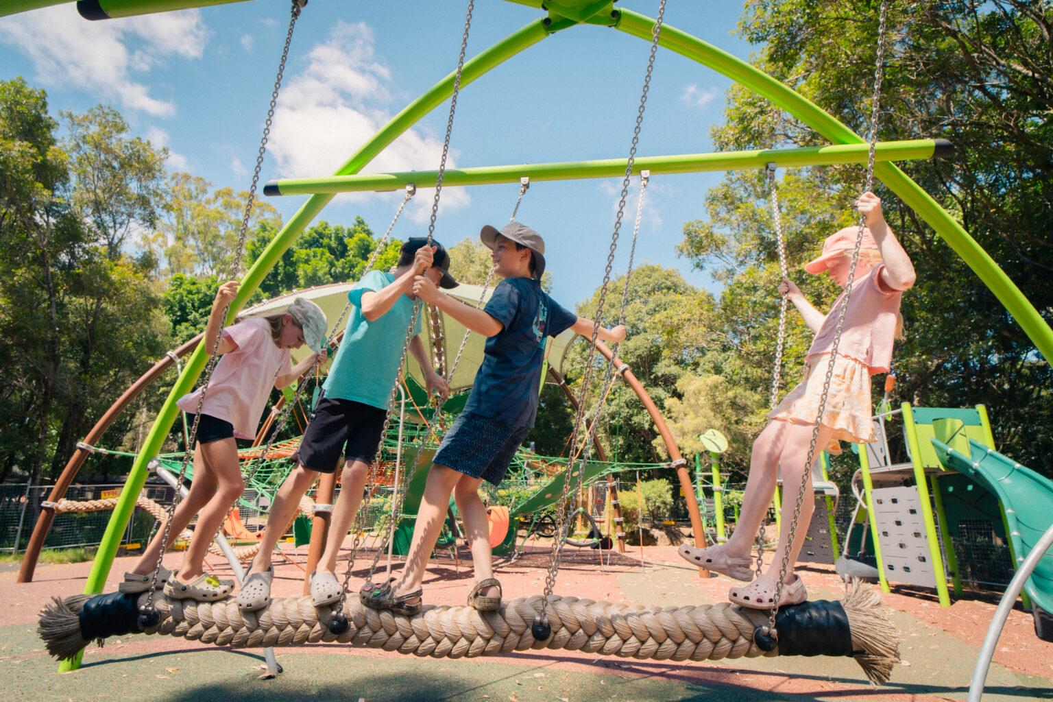 Children enjoying the swinging ropes