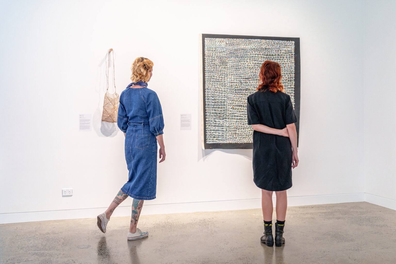 Women admiring the stunning artwork at the gallery